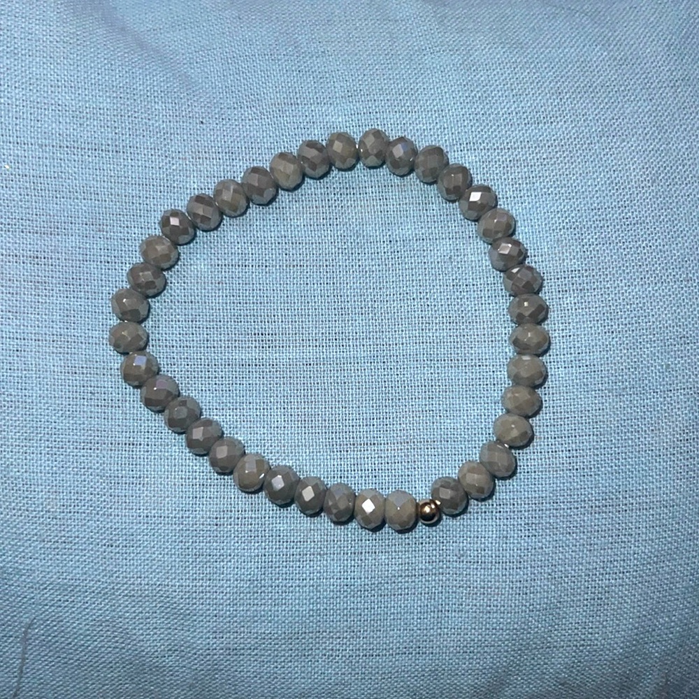 This is a set of 3 blue bracelets. They are sort of but stretchy fit very well.